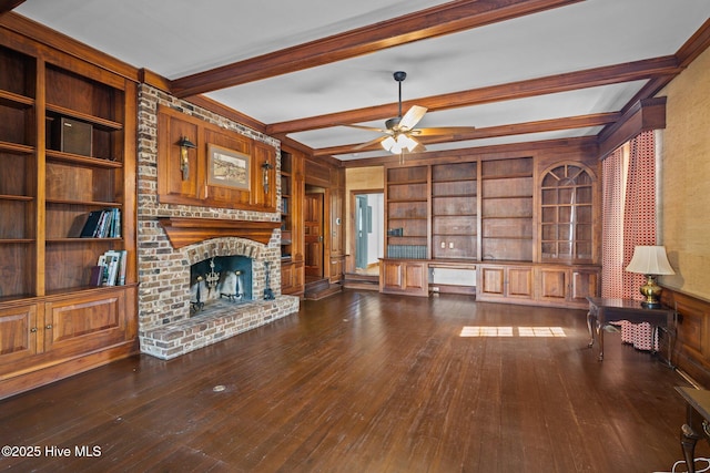 living room featuring hardwood / wood-style floors, a brick fireplace, and beam ceiling