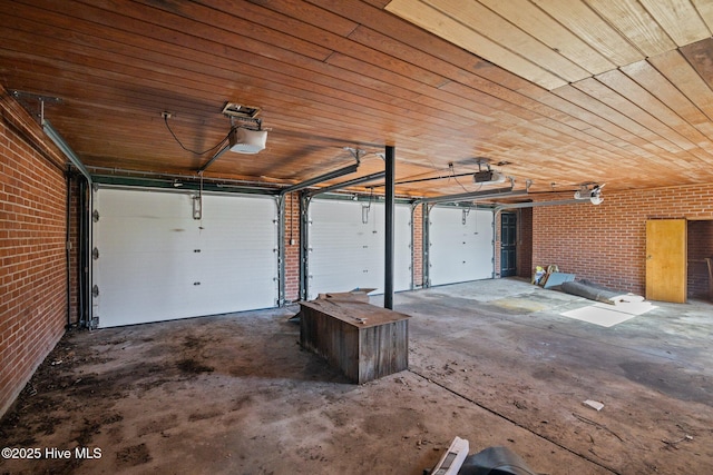 garage featuring wooden ceiling and a garage door opener