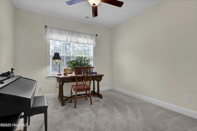 office with light carpet, ceiling fan, visible vents, and baseboards