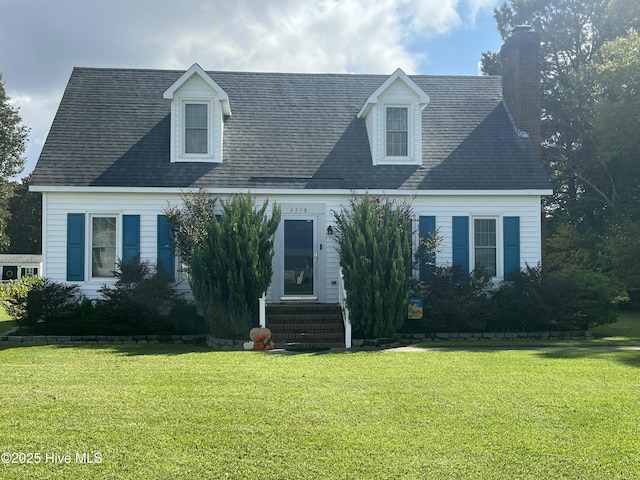 cape cod-style house featuring a front yard