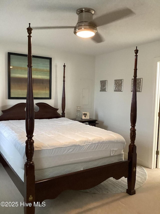 carpeted bedroom with ceiling fan