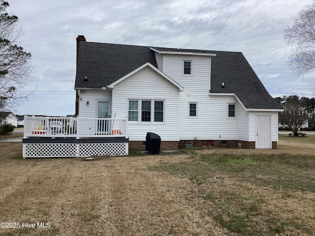 back of house with a yard, a wooden deck, a shingled roof, crawl space, and a chimney