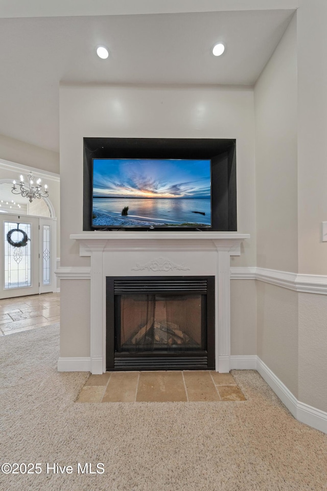 details featuring recessed lighting, baseboards, and a fireplace with flush hearth