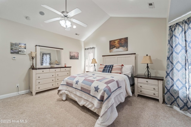 bedroom with visible vents, light carpet, lofted ceiling, and a ceiling fan