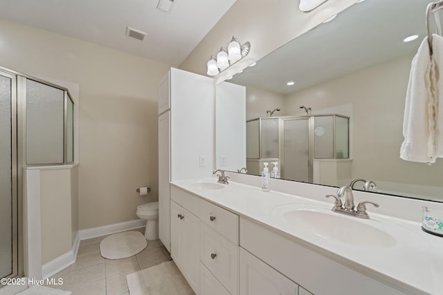 bathroom with a sink, visible vents, a shower stall, and tile patterned floors