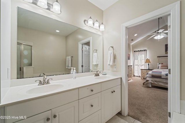 full bathroom featuring ensuite bath, vaulted ceiling, a stall shower, and a sink