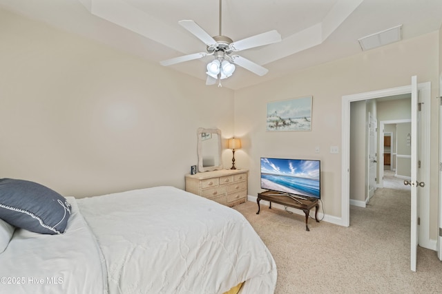 bedroom with visible vents, light carpet, baseboards, and a ceiling fan