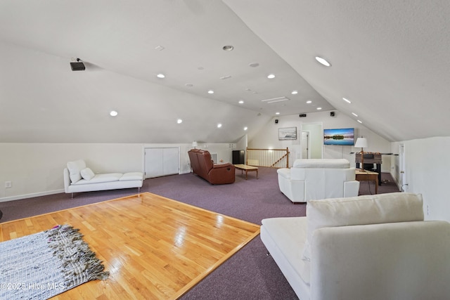 living area with recessed lighting, baseboards, carpet, and lofted ceiling