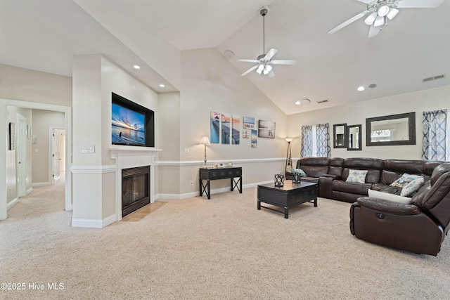 living area with visible vents, a fireplace with flush hearth, carpet flooring, recessed lighting, and high vaulted ceiling