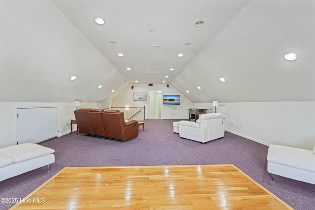 unfurnished living room featuring recessed lighting, lofted ceiling, carpet, and wood finished floors