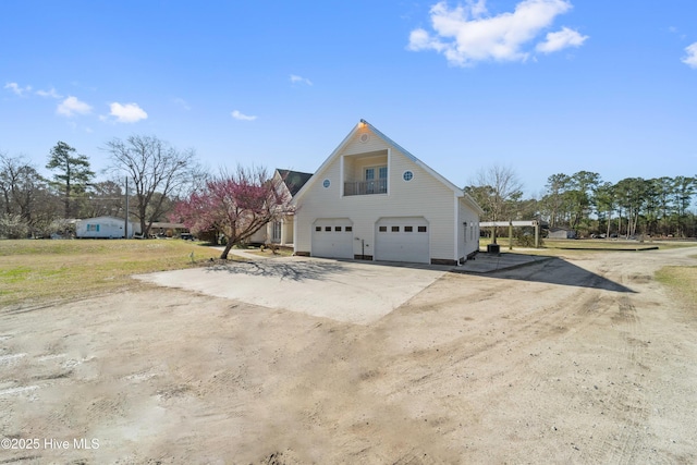 view of home's exterior featuring driveway