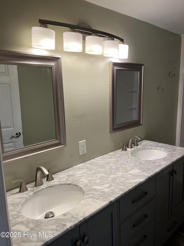 bathroom featuring double vanity and a sink