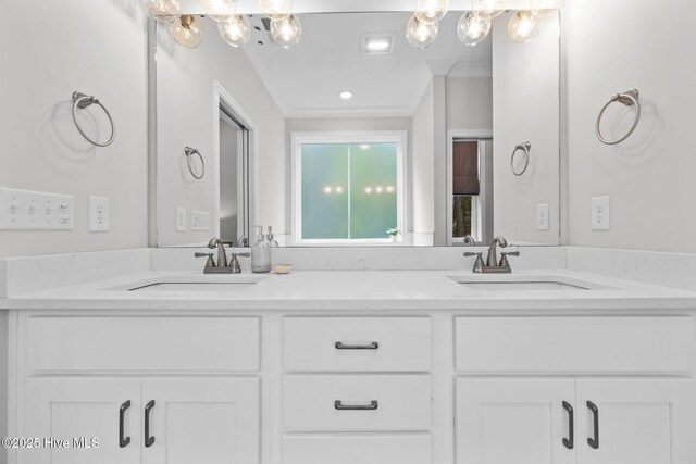 876 Elderberry Dr, Vass, NC 28394 - full bathroom with double vanity, a sink, and a chandelier