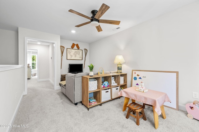 carpeted living room featuring baseboards, visible vents, a ceiling fan, and recessed lighting