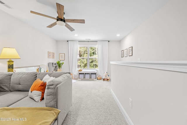 living room with recessed lighting, a ceiling fan, visible vents, baseboards, and carpet