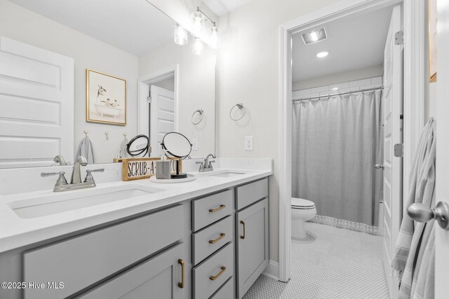 876 Elderberry Dr, Vass, NC 28394 - full bathroom featuring double vanity, a sink, toilet, and tile patterned flooring