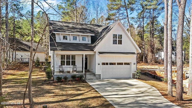 modern farmhouse style home with driveway, covered porch, and roof with shingles