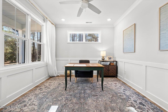 home office featuring visible vents, a ceiling fan, ornamental molding, a decorative wall, and recessed lighting