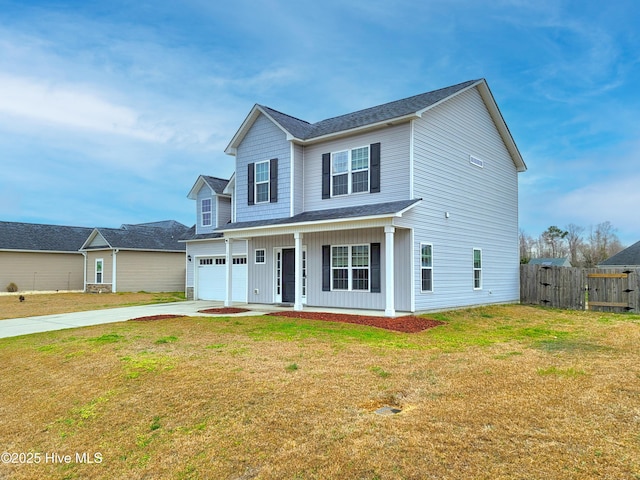 view of front of home featuring an attached garage, a front lawn, fence, covered porch, and driveway