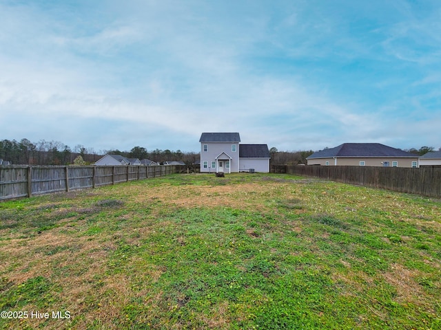 view of yard featuring a fenced backyard