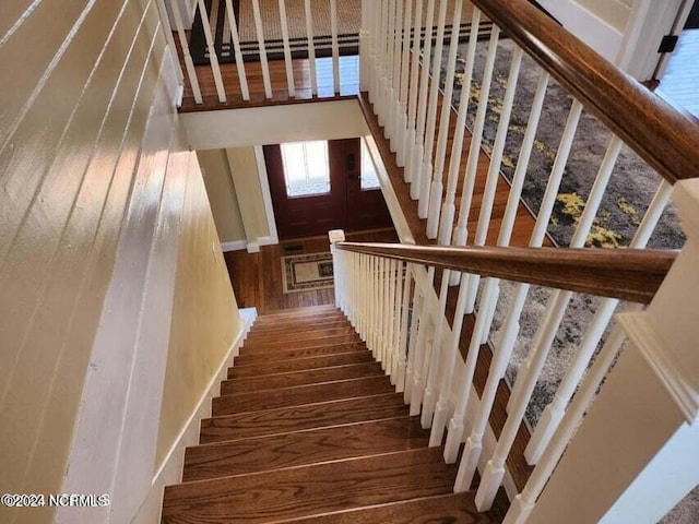 staircase featuring wood finished floors