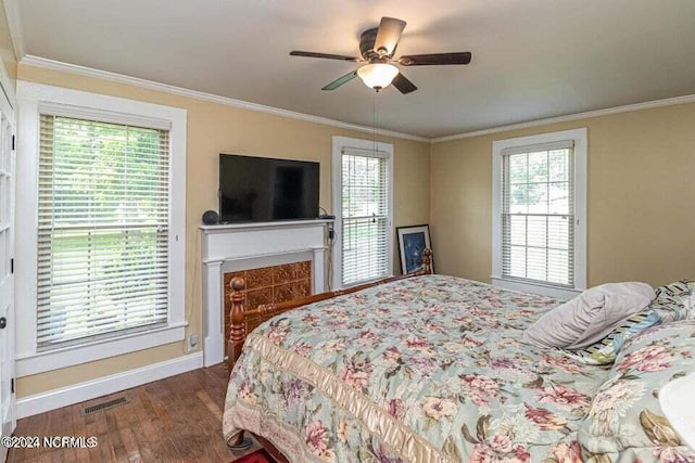 bedroom with visible vents, multiple windows, and ornamental molding