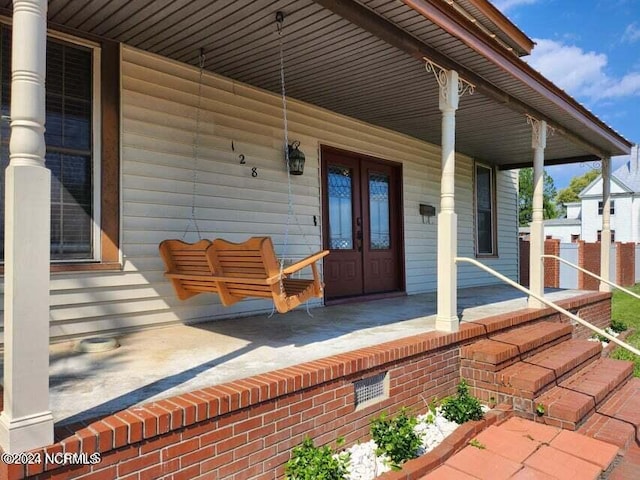 view of patio / terrace with covered porch and french doors