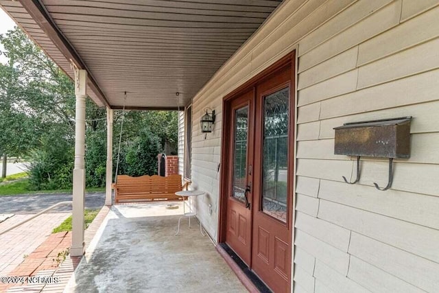 property entrance with a porch