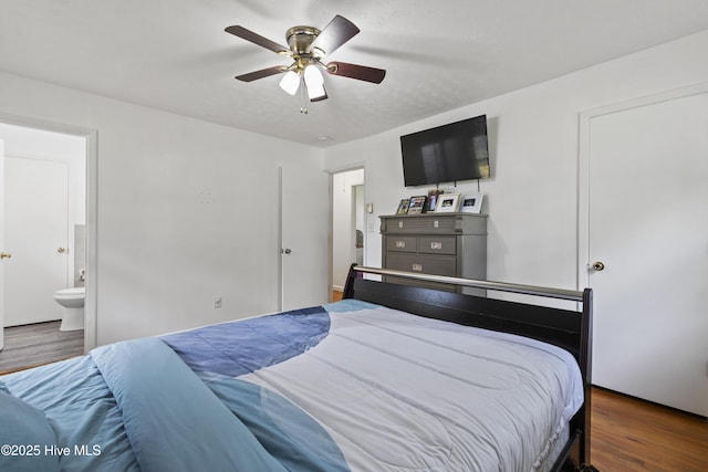 bedroom featuring a ceiling fan, connected bathroom, and wood finished floors