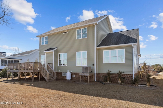 back of house featuring a deck, central AC unit, stairway, and a shingled roof