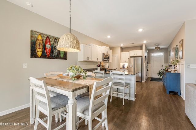 dining area featuring dark wood-style floors, baseboards, and recessed lighting