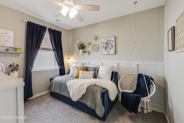 bedroom with visible vents, a ceiling fan, and carpet flooring