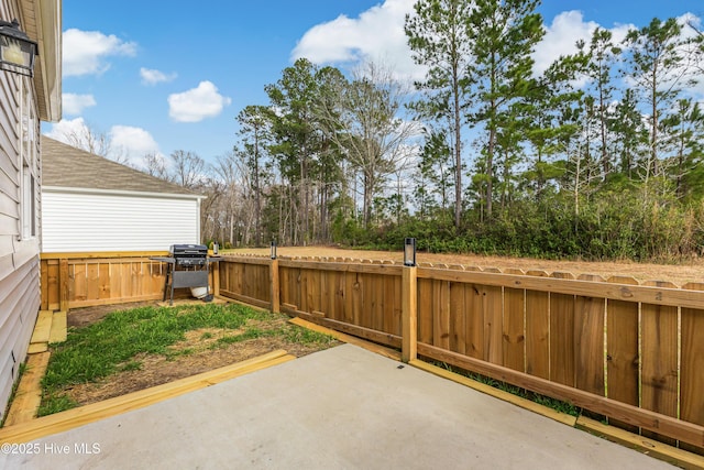 view of patio / terrace featuring fence