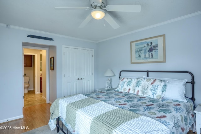 bedroom featuring ornamental molding, a closet, ceiling fan, and wood finished floors