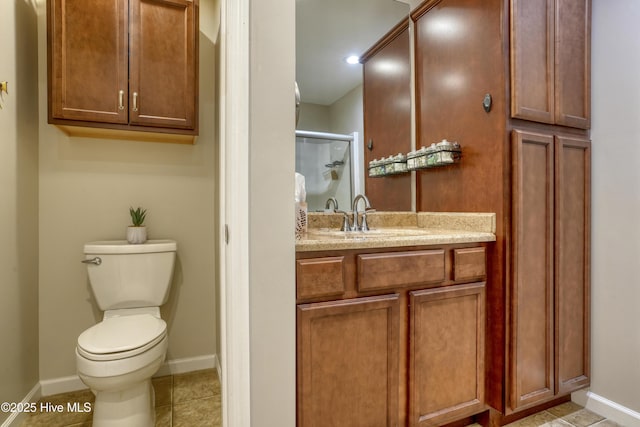 full bath featuring tile patterned flooring, toilet, vanity, baseboards, and a stall shower