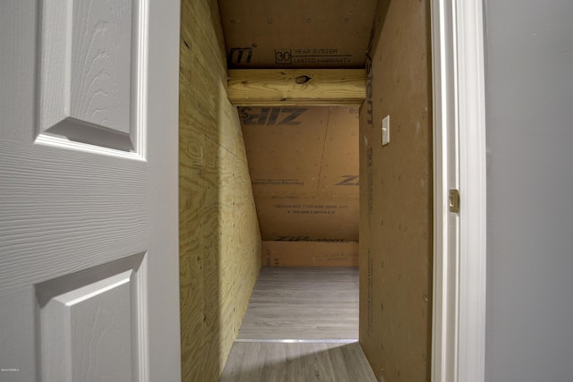 corridor featuring wood finished floors