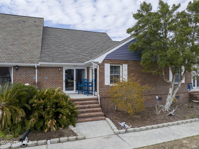 view of front of home with brick siding