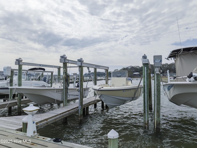 view of dock featuring a water view and boat lift