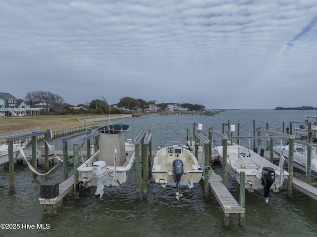 dock area with a water view and boat lift