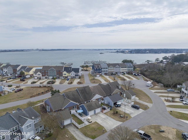 drone / aerial view featuring a water view and a residential view