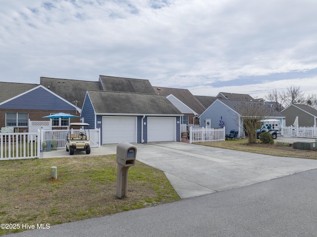 ranch-style house with a front yard, fence, and a residential view