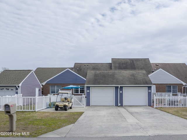 ranch-style house with a garage, a front yard, and fence