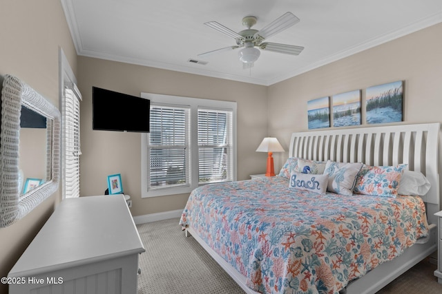 carpeted bedroom with baseboards, a ceiling fan, and crown molding