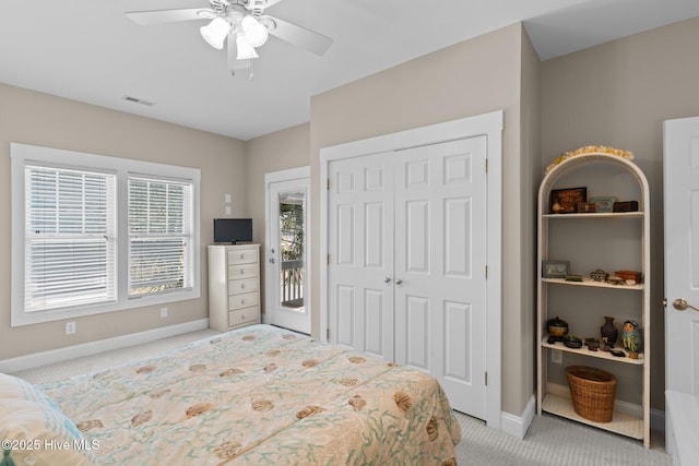 bedroom featuring baseboards, visible vents, carpet floors, and a closet