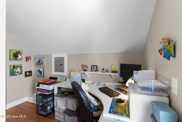 office with vaulted ceiling, electric panel, wood finished floors, and baseboards