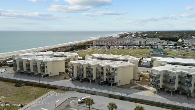 bird's eye view with a water view and a view of the beach