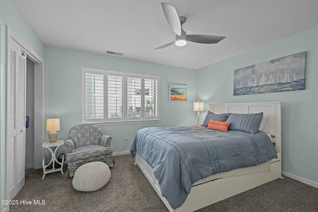 bedroom featuring baseboards, a closet, visible vents, and carpet flooring