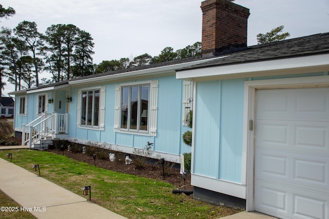 view of front of house featuring a chimney