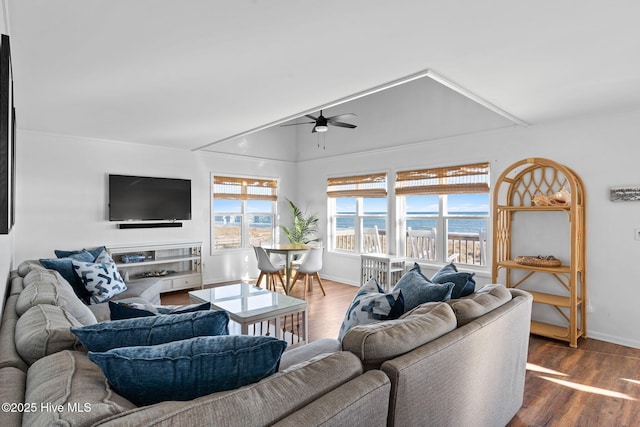 4827 W Beach Dr, Oak Island, NC 28465 - living room with ceiling fan, baseboards, and wood finished floors
