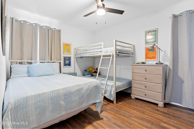 4827 W Beach Dr, Oak Island, NC 28465 - bedroom featuring ornamental molding, ceiling fan, and wood finished floors